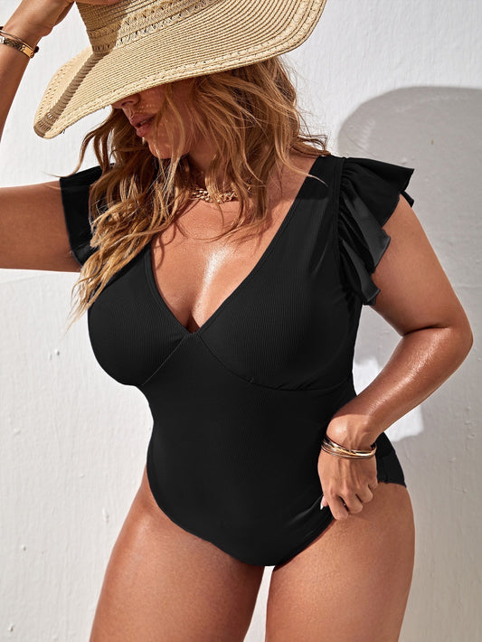 Calzoneta negra con vuelos en mangas